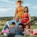 Generational family enjoying a sunny day picnic in La Dorada, Caldas.